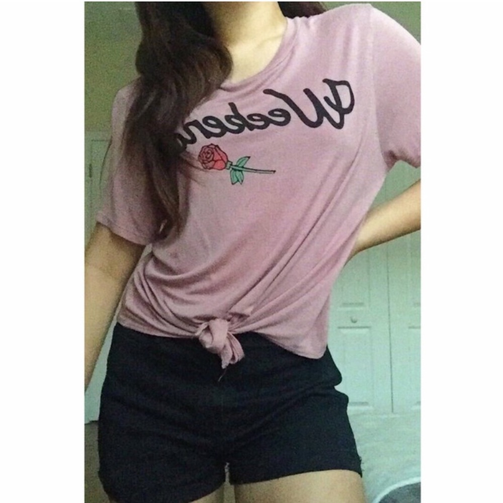 mauve purple t-shirt with graphics on it